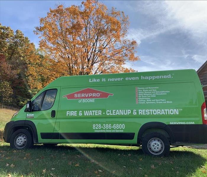 Our SERVPRO Van servicing a house on a beautiful fall day
